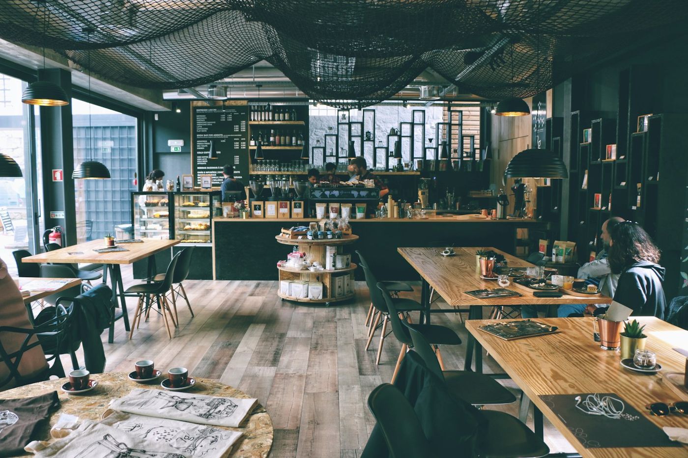 The dining room at The Outlook Cafe with timber tables and plants